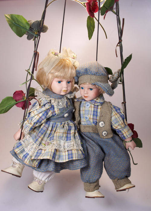 Other Antiques & Collectables Boy and girl porcelain dolls on swing