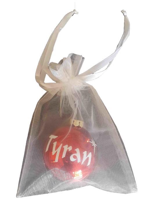 Personalised name bauble packed in a white organza bag