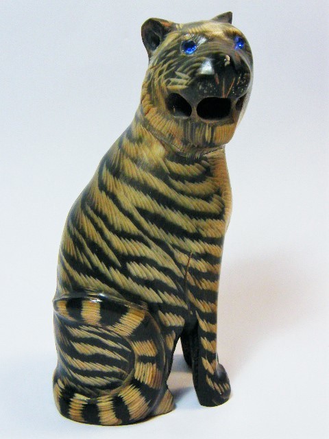 Beautiful carved tiger figurine with blue stone eyes - carved from horn