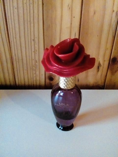 perfume bottle with rose on top