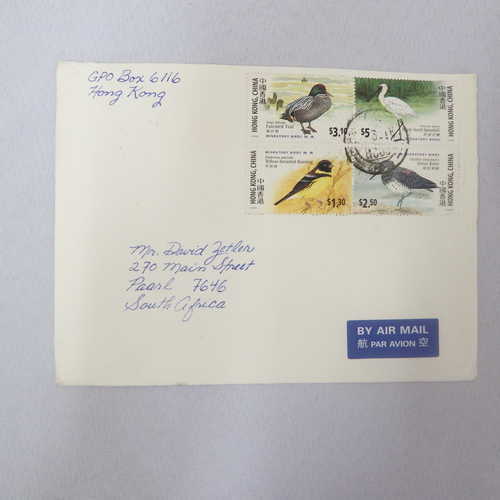 Airmail cover from Hong Kong to Paarl South Africa with Airmail tag and 4 Hong Kong stamps cancelled