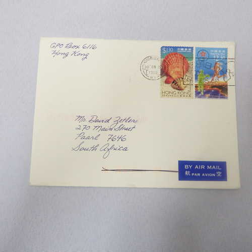 Airmail cover from Hong Kong to  Paarl, South Africa with airmail tag