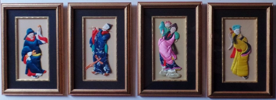FRAMED SET OF FOUR CHINESE SILK APPLIQUE FIGURES