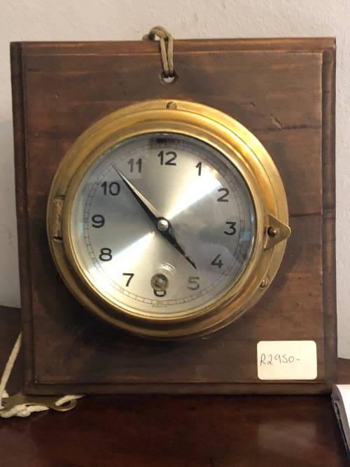 Other Clocks BRASS SHIPS CLOCK ON WOODEN BASE was listed for R2,750.