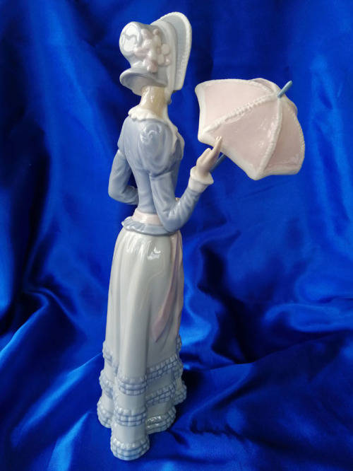Porcelain & Ceramic lladro lady with Umbrella was sold for R750.00 on